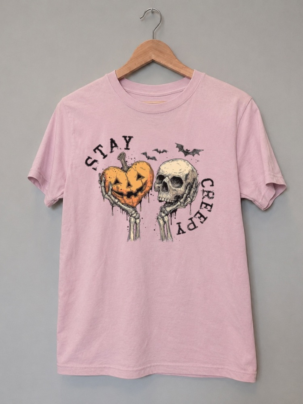 Stay Creepy Halloween Pumpkin and Skeleton Pink Graphic Tee
